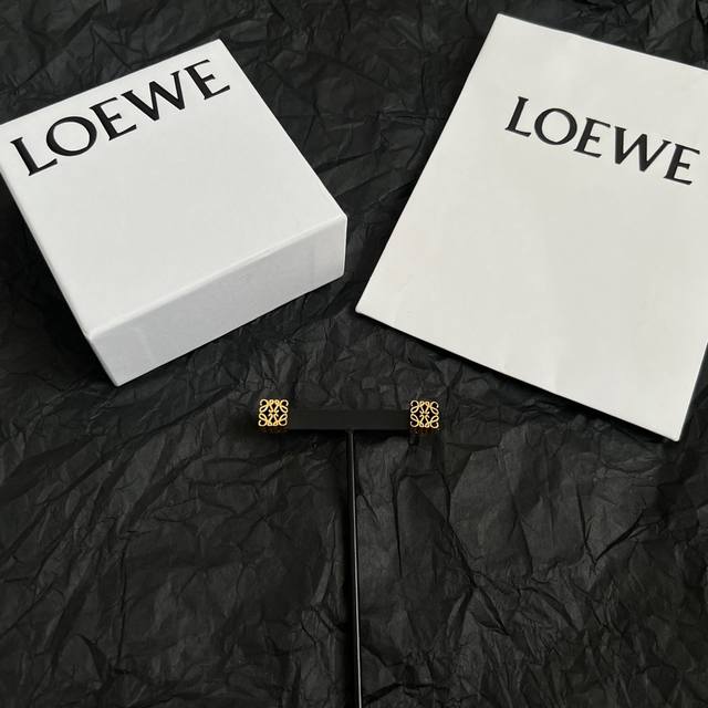 New L0Ewe earrings, featuring an Anagram 3D pendant and a circular clasp with a New L0Ewe earrings, featuring an Anagram 3D pendant and a circular clasp with a