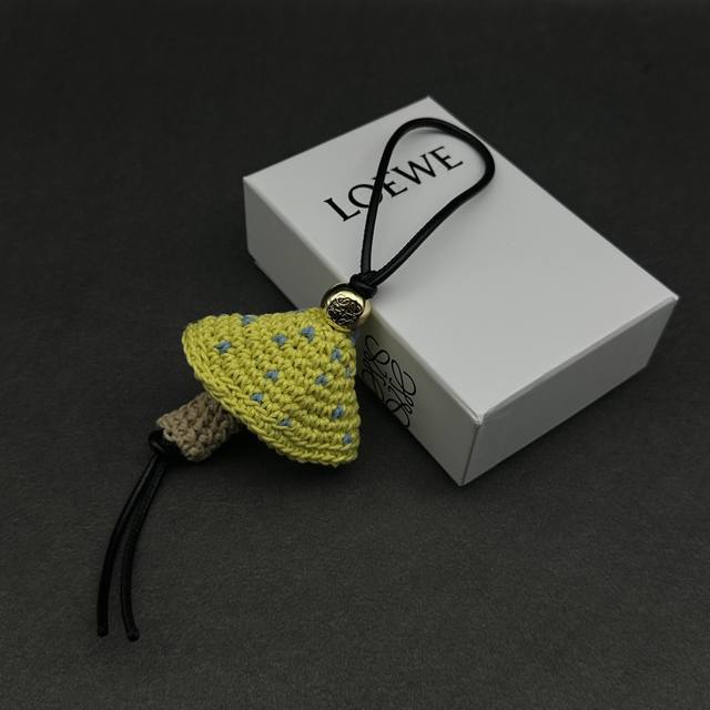 New Arrival: Loewe Anagram Pebble charm with a cowhide leather strap and gold fi New Arrival: Loewe Anagram Pebble charm with a cowhide leather strap and gold fi