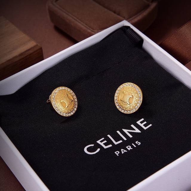 Celine's new gold Arc de Triomphe earrings feature a unique and distinctive desi Celine's new gold Arc de Triomphe earrings feature a unique and distinctive desi