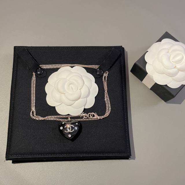 Our Product: Double-Sided Black Heart Necklace, Purchased Through A Proxy For Z
