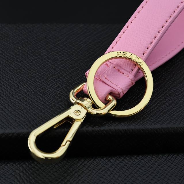 Prada Keyring F0002 Crafted From Saffiano Leather, This Keyring Features A Tie-I