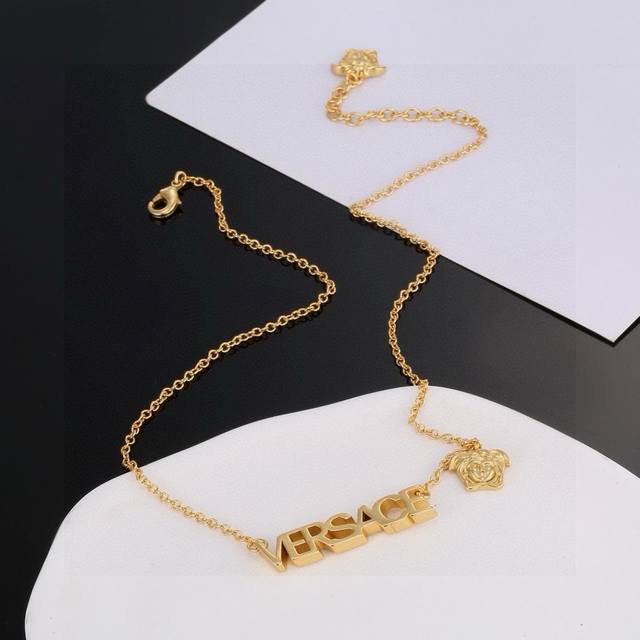 Versace This Gold Necklace Is An Elegant Accessory Featuring A Medusa Head And L