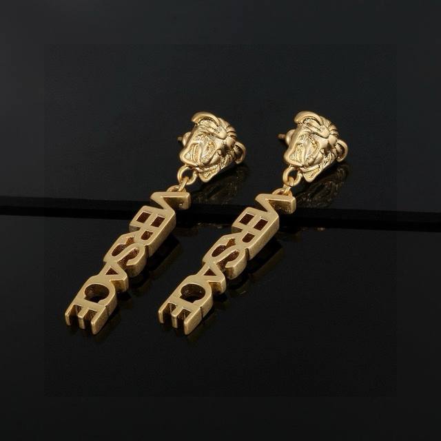 Versace This Gold Earring Is An Elegant Accessory Featuring A Medusa Stud And A