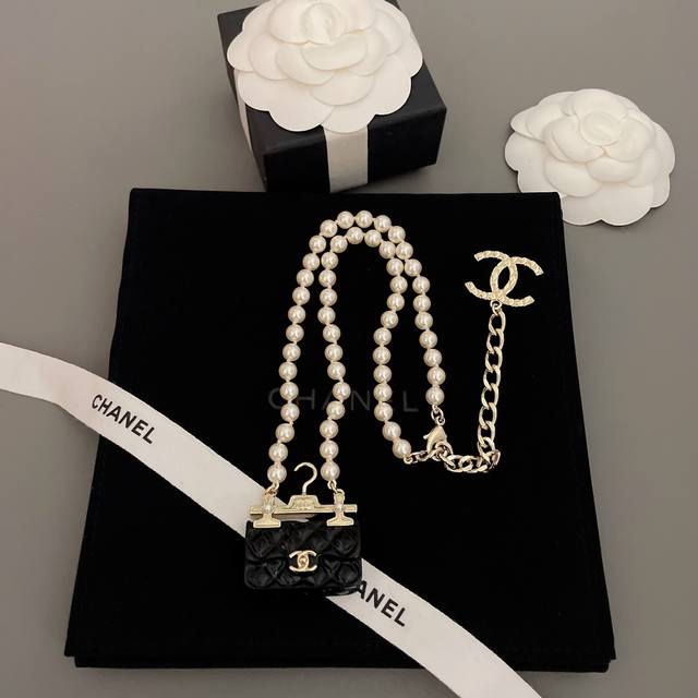 Our Exclusive Collection: Pearl Necklaces, Handbags, And Clothing Hangers. Z 950