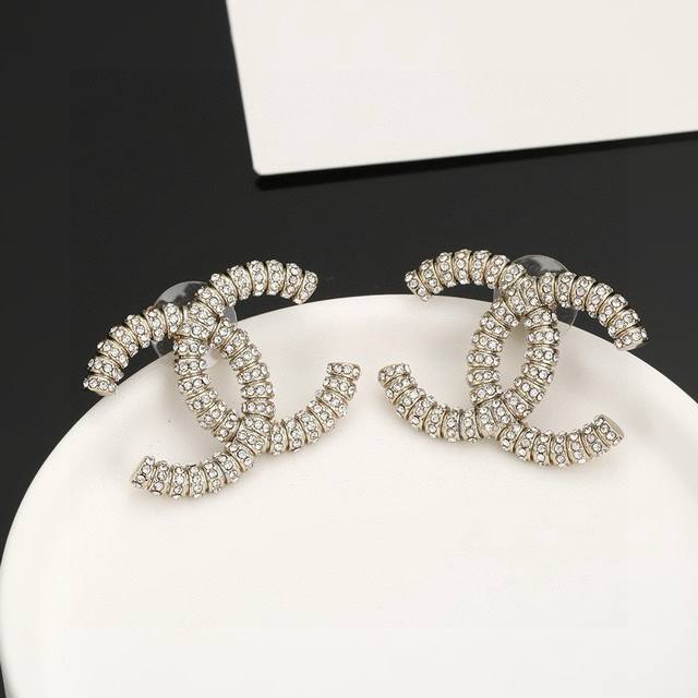 Gold And Silver Chanel Classic Double C Stud Earrings. This Versatile Piece Is I