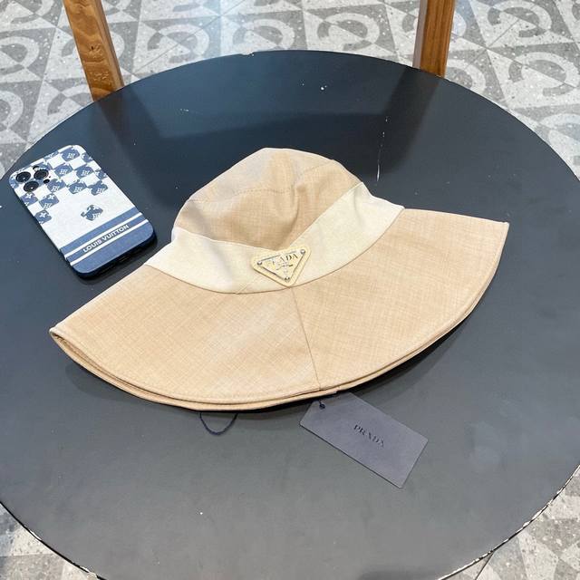 Prada New Fisherman's Hat, A Must-Have For Vacations.