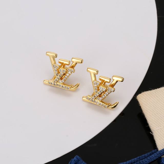 Louis Vuitton Gold-Colored Letter Earrings. Louis Vuitton's Unique Style Brings
