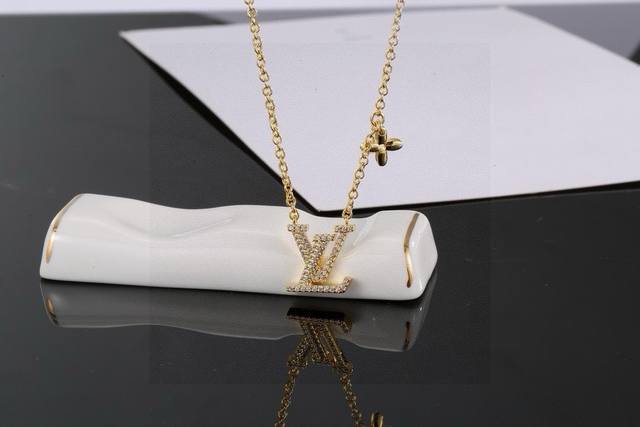 Lv Golden Letter Necklace By Louis Vuitton. Unique And Stylish, This Necklace Fe