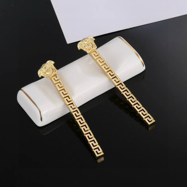 Versace This Golden Earring Is An Elegant Accessory Featuring A Medusa Stud And