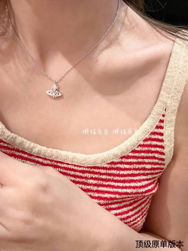 Queen Elizabeth Saturn Diamond-Studded Necklace The Timeless Saturn-Shaped Surfa