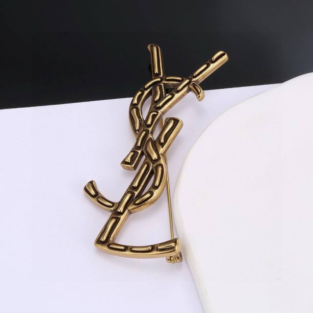 Yves Saint Laurent Brooch, Original Brass Material. Founded In 1961, Yves Saint