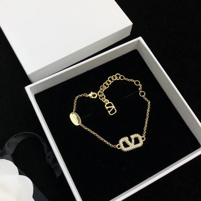 Valentino V-Logo Metal And Synthetic Crystal Bracelet. The Girl Who Used To Snea