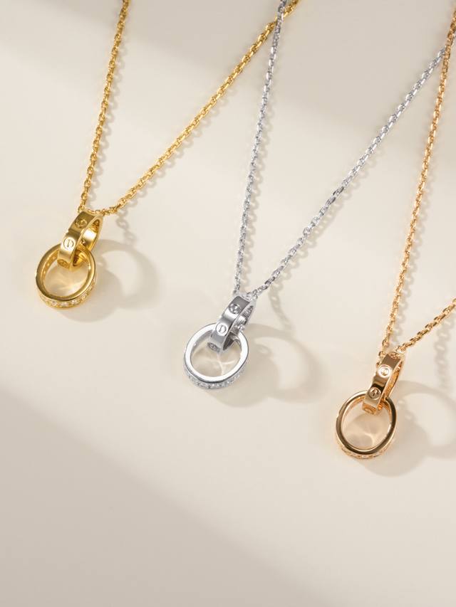 Diamond-Encrusted Double Ring Necklace. The Classic Cartier Love Timeless Design