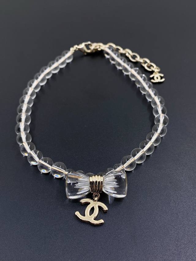 Chanel's Latest Transparent Bow Necklace, Consistent With Zp Brass Material.