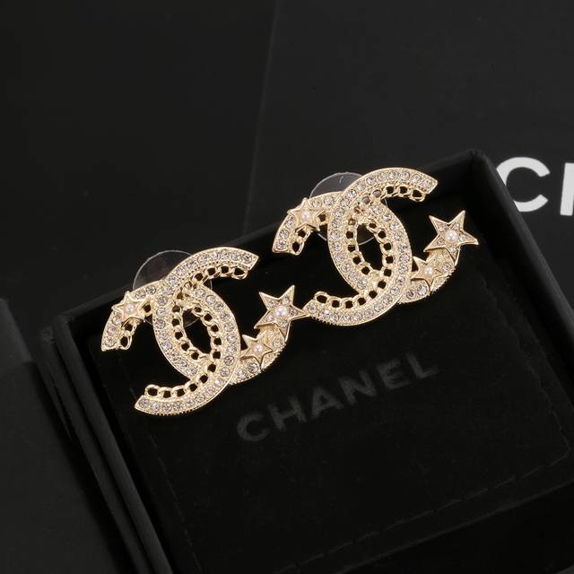 Chanel Ear Studs, Designed To Flatter The Face. Surrounded By Golden Metal Edges