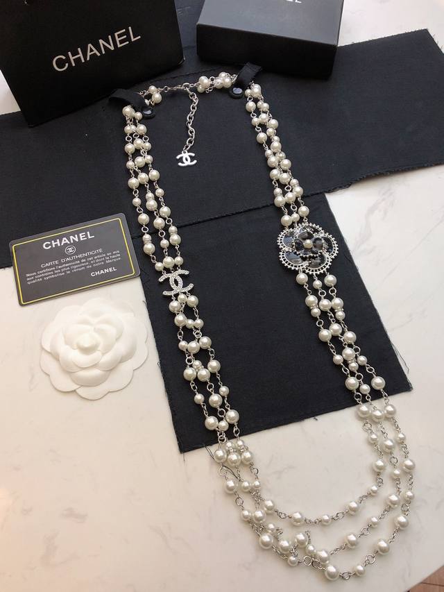 Chanel Camellia Three-Layer High-Fashion Pearl Sweater Chain. Pearls Evoke An El