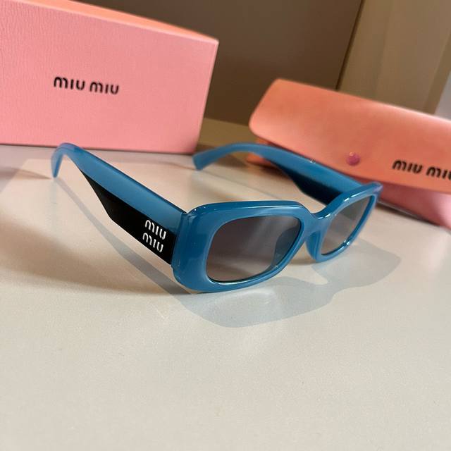 Miu Miu Sunglasses, Black And White With The Logo The Perfect Combination. A Mus