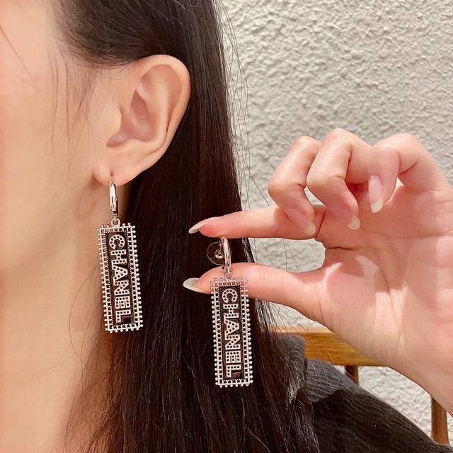 Chanel Openwork Letter Earrings