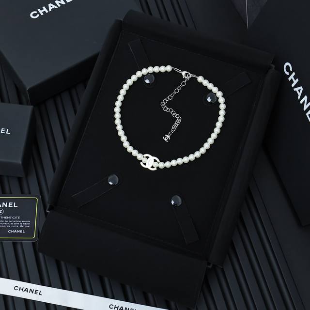 Chanel Resin Letter Pearl Necklace The Chanel Pearl Necklace Exudes A Full Atmos