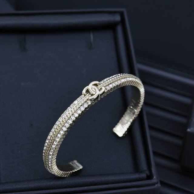 Chanel Gold-Embossed Woven Crystal Double C Open Bracelet. A Simple And Elegant