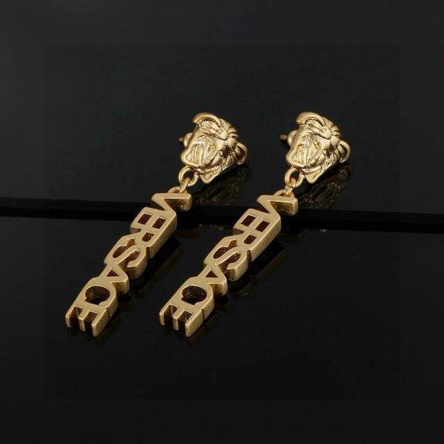 Versace This Golden Earring Is An Elegant Accessory Featuring A Medusa Stud And