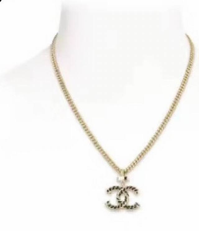 Leather-Wrapped Black And Gold Double C Necklace. The Classic Leather-Wrapped Se