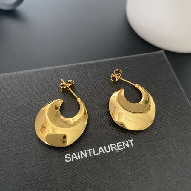 Saint Laurent Crescent Moon Minimalist Earrings.