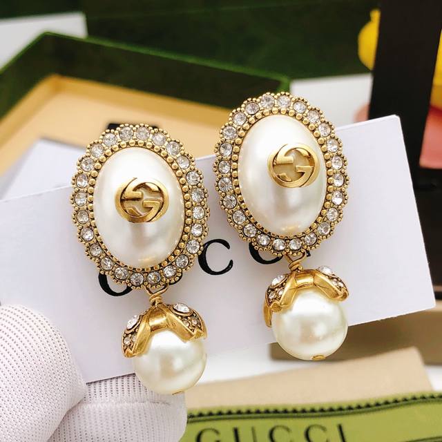 Code Ged0198 Gucc* Latest Model Oval White Stud Earrings, Zp Brass Material