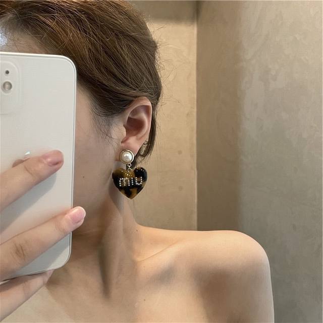 Miu Miu Acrylic Heart Earrings, A Must-Have For Every Fashion Influencer. This C
