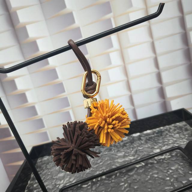 Miu Miu's Bold And Playful Personality Shines In This Soft Leather Mini Charm. D
