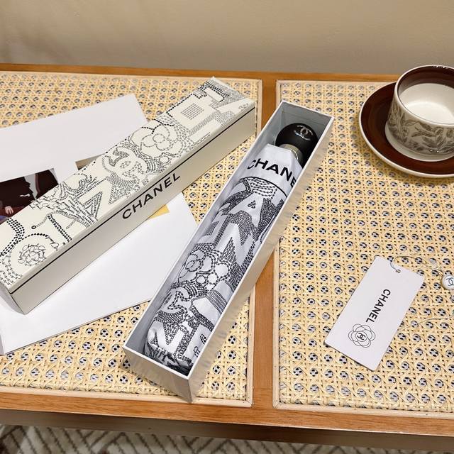 chanel Chanel's New Three-Fold Automatic Folding Umbrella Is Exquisitely Craf