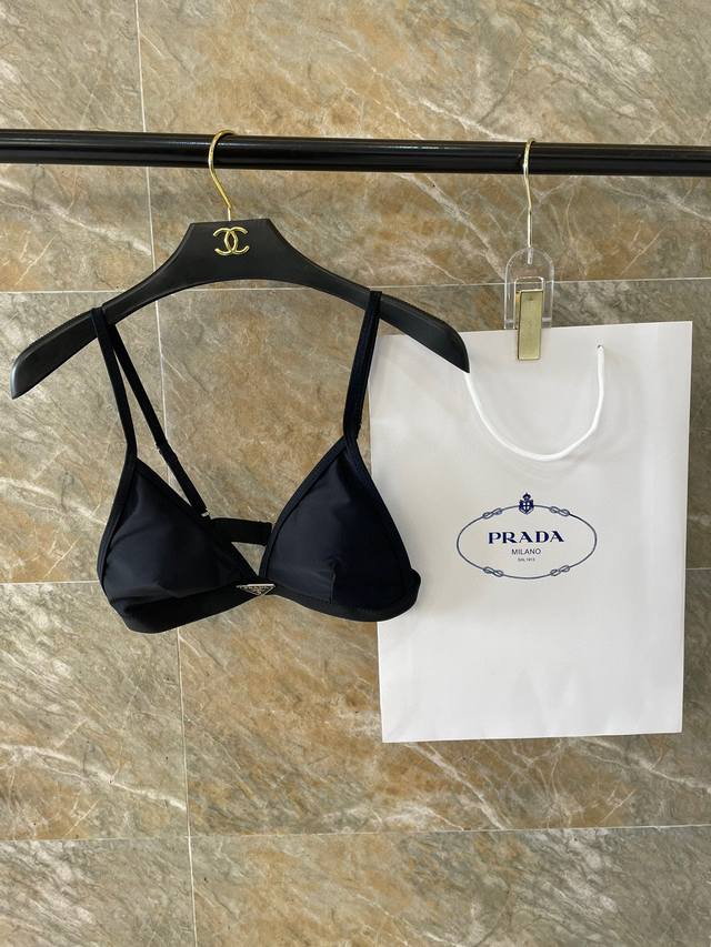 Prada's New Backless One-Piece Swimsuit Is Simple And Elegant In Black. It Is Su