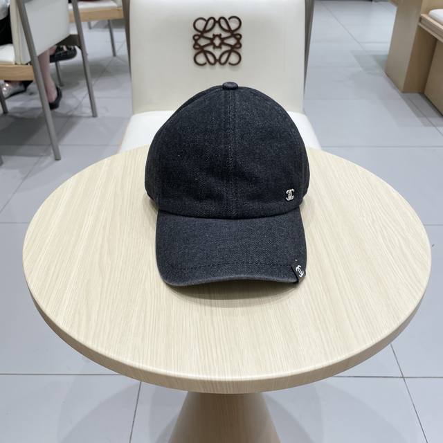 Chanel's new denim blue retro baseball cap. Take it with you on holidays. It's a