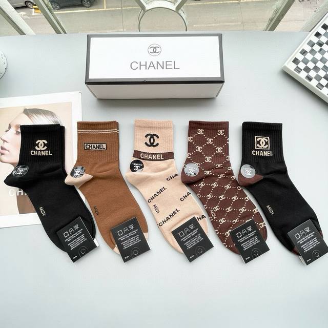 comes with a box of five pairs of Chanel's popular card-style middle-tube socks,