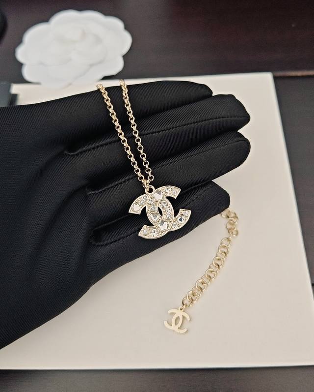 Chanel's new double C letter diamond-studded gold earrings are available at the