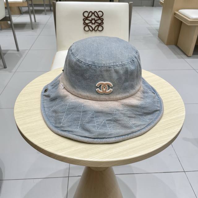 Chanel's new denim blue retro style fisherman's hat. Take it with you on holiday