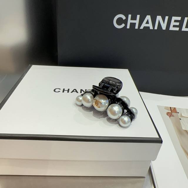 with box Chanel's latest pearl clip. Super pretty! Very ladylike, a must-have fo