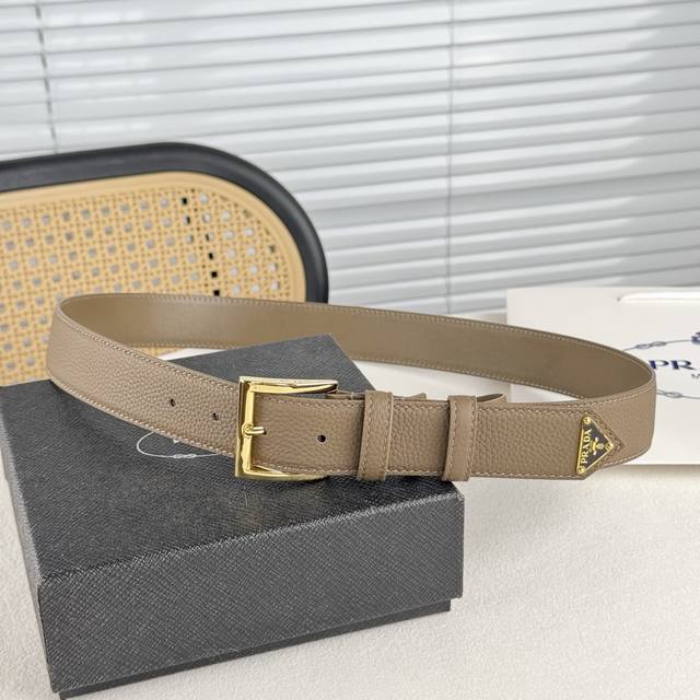 Unisex, this gorgeous pebbled leather belt from Prada exudes simple yet sophisti