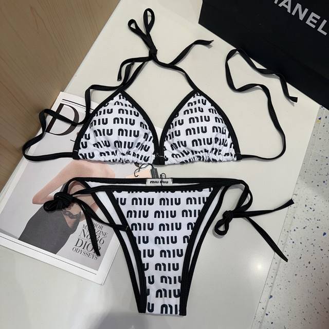 Miumiu swimsuit, a must-have for fashionistas. Super figure-flattering! Sml