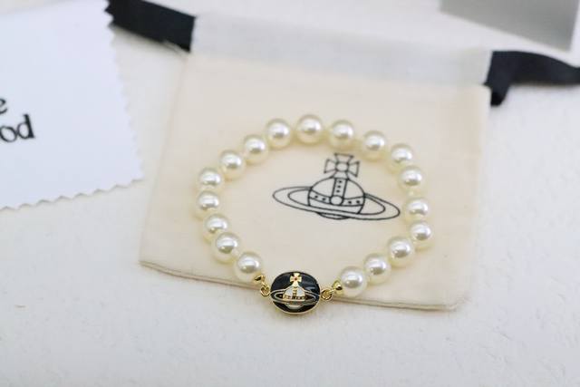 New product, highest quality Queen Mother Vivienne round black enamel Saturn pea
