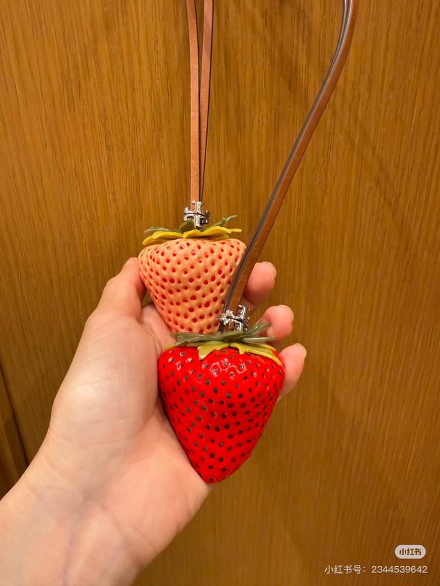 This strawberry pendant from Tory Burch is super cute! The shape is lifelike, as