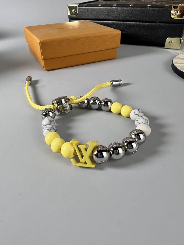 The Lv Monogram Beads bracelet showcases a diverse fusion of materials and tones