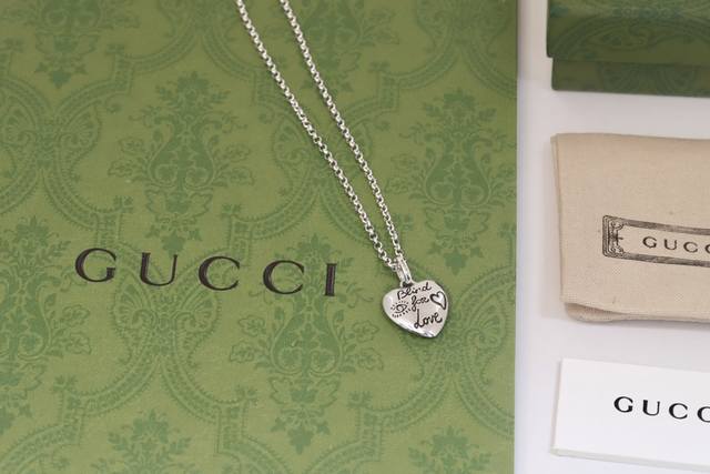 New Arrival Gucci* necklace features a heart-shaped pendant, engraved on both si