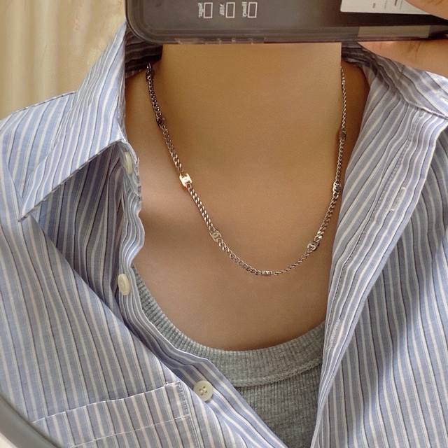 Chanel's latest double C necklace is made of stainless steel and retains color.