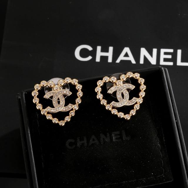 Chanel light gold heart peach earrings keep up with the trend. Early spring earr