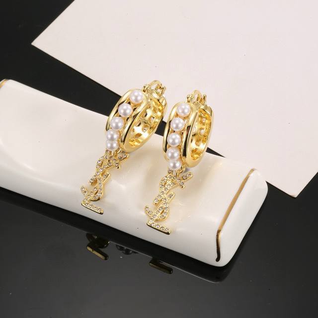 Ysl Saint Laurent earrings original brass material Yves Saint Laurent was founde