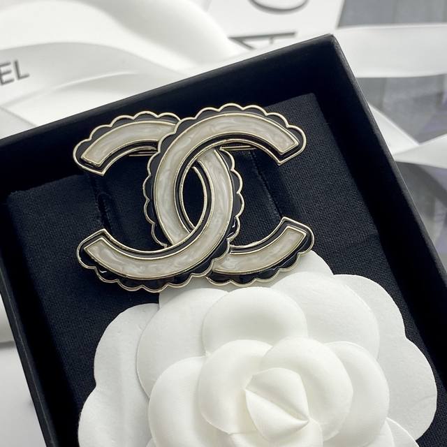Code A699 Chanel brooch is hot selling and has a new arrival Chan 24 black ename