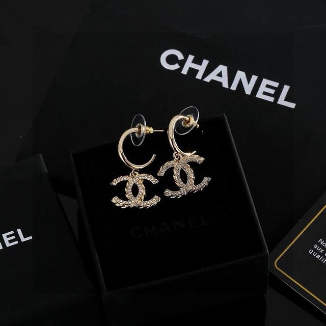 Chanel light gold earrings keep up with the trend. Early spring earrings. Whethe