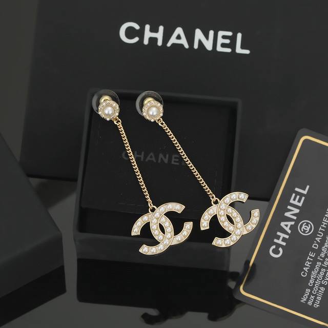 Chanel classic double C long pearl earrings. This is a very good-looking and ver