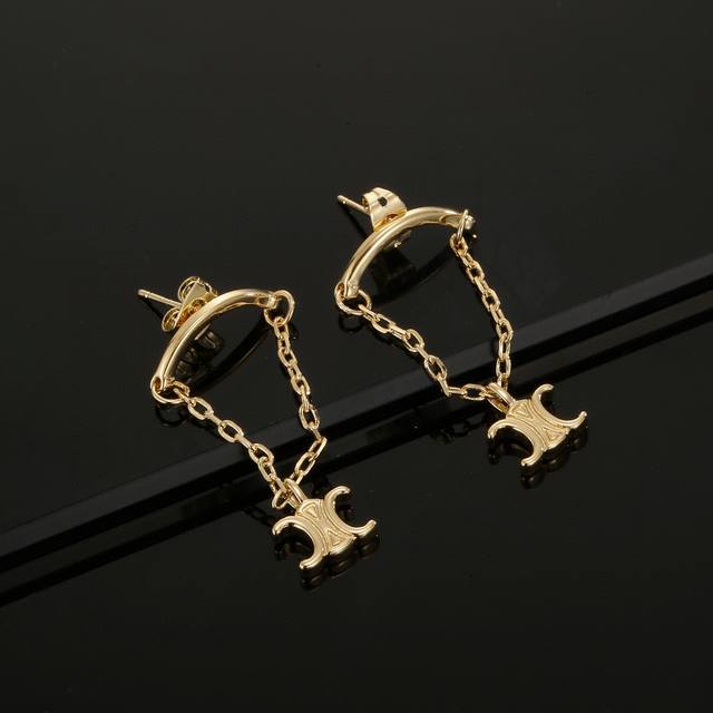 Celine earrings are classic gold in color. The highly recognizable twist design